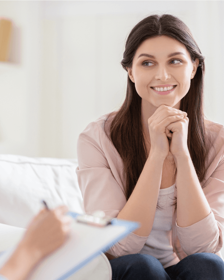 Smiling woman talking to health coach about motivation