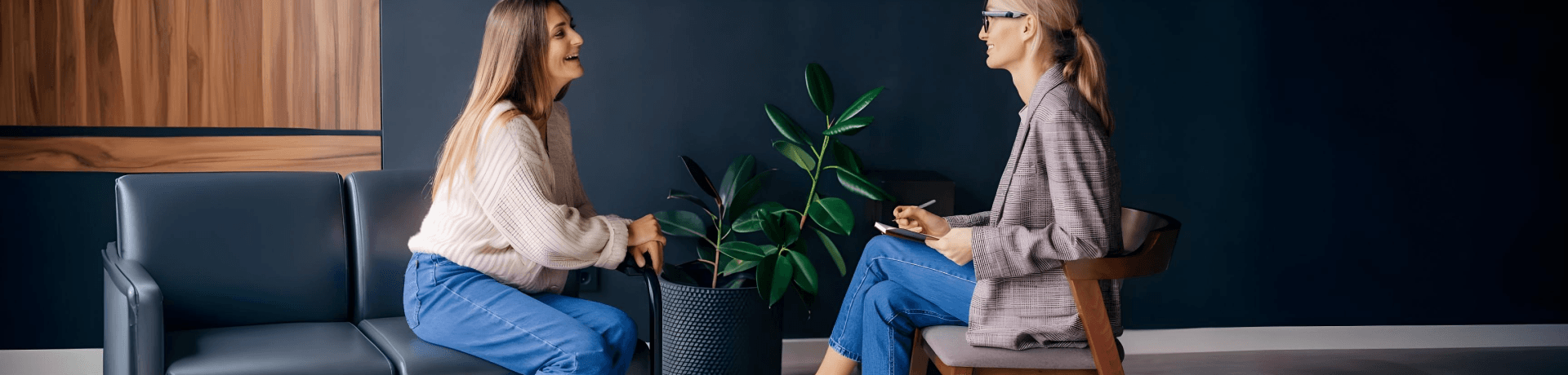 Smiling woman talking to health coach about motivation